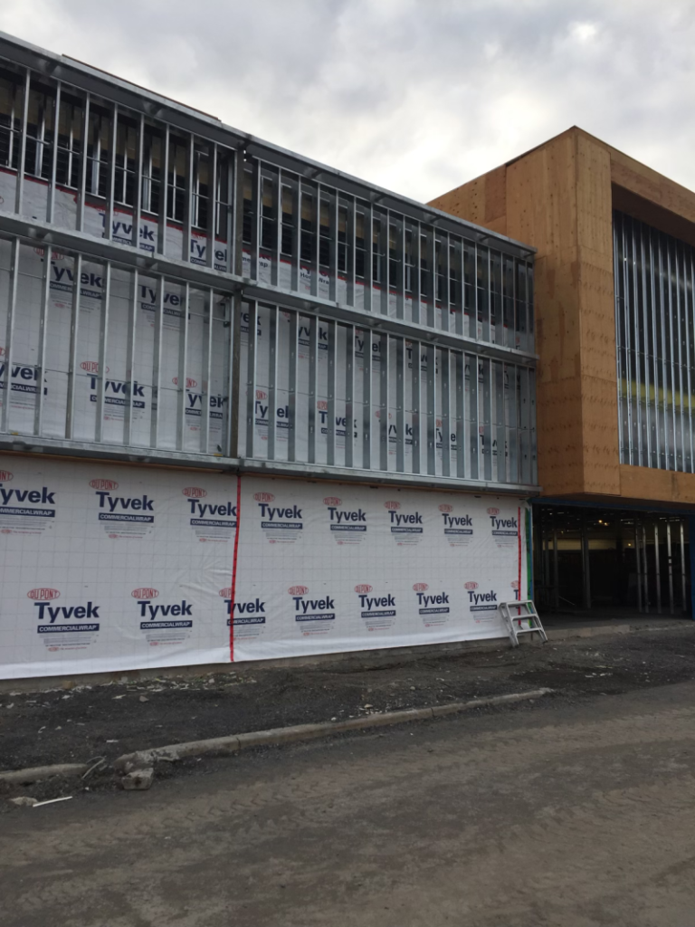 Outside of building showing plastic covering